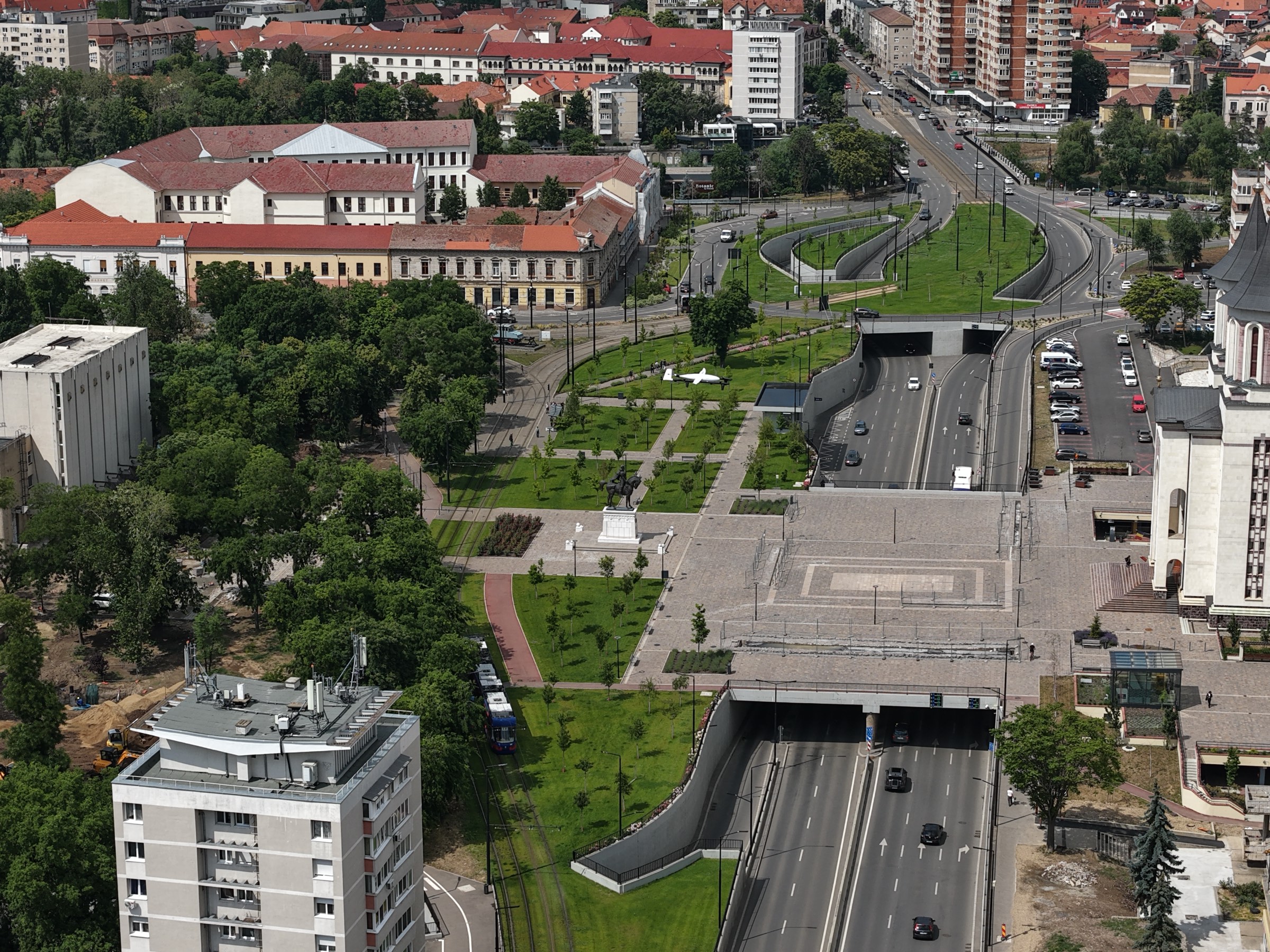 KITE on a low pass over central Oradea, tram lines and road tunnel below
