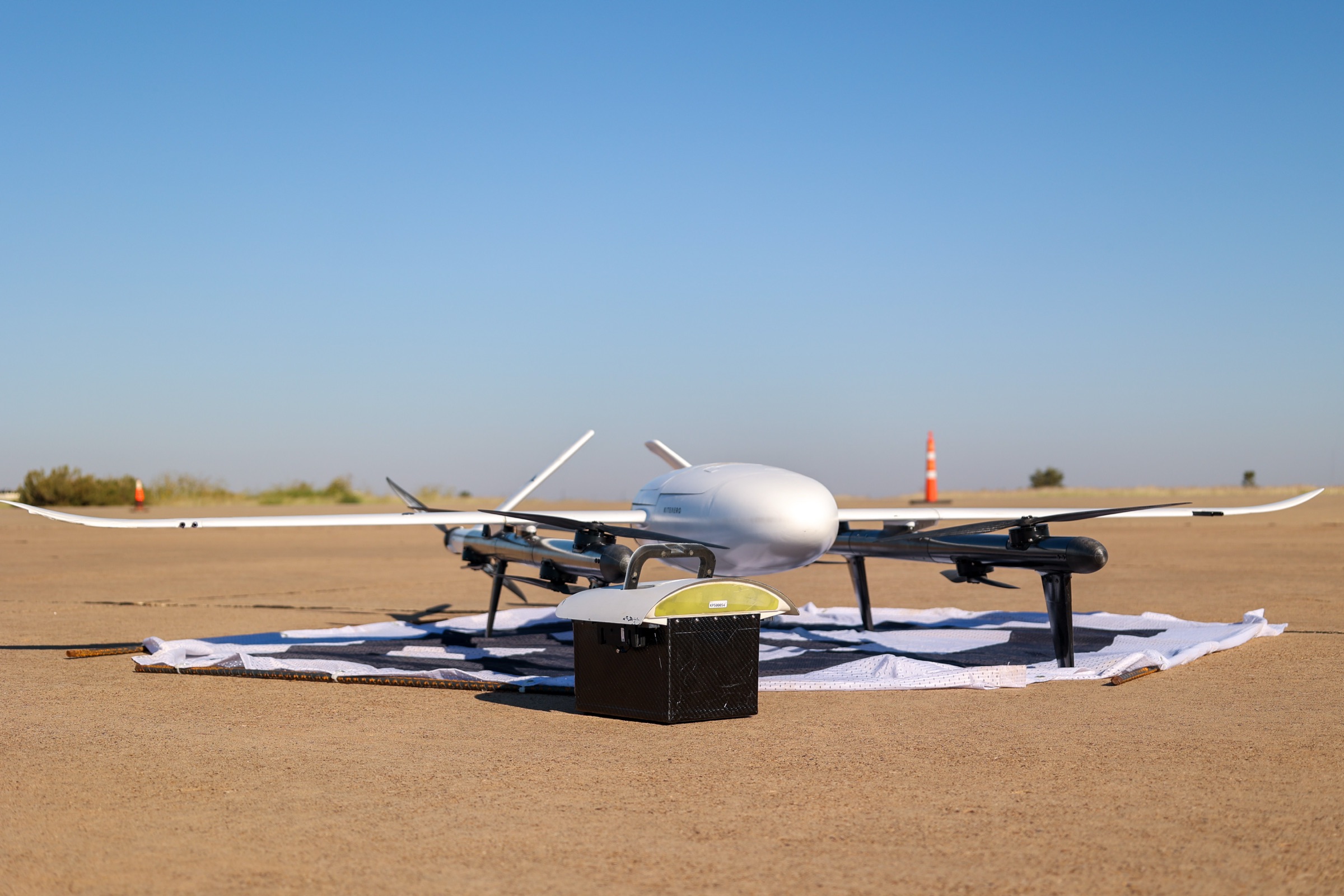KITE fixed wing UAS on the apron with its payload case