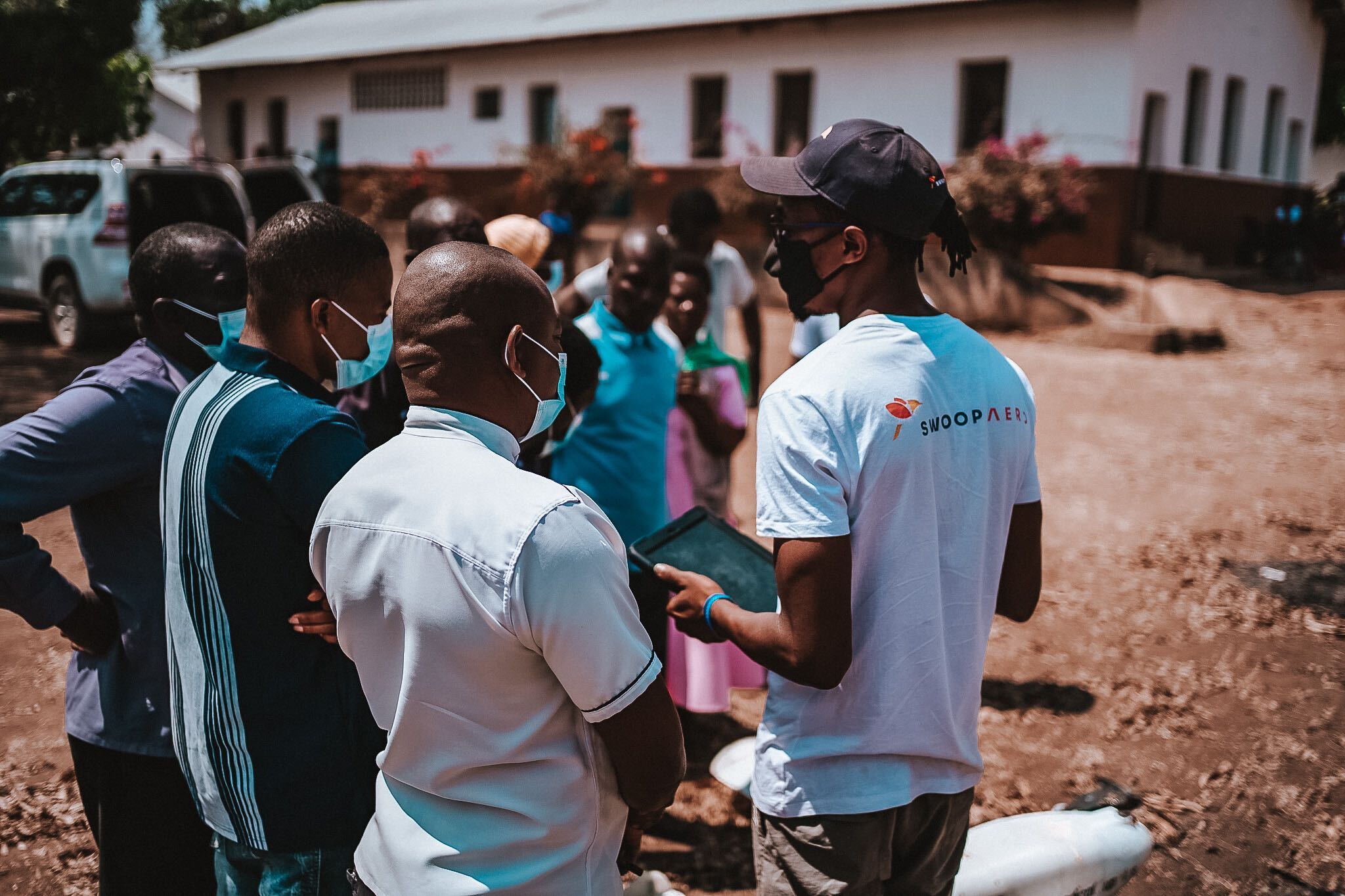 Malawi health professionals learning how to receive and send health supplies by drone.